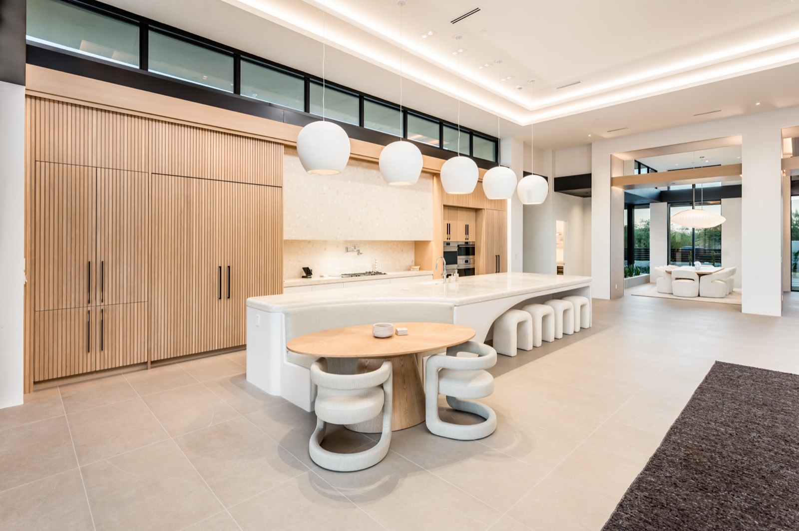 Kitchen island and oak wall seen from the dining area