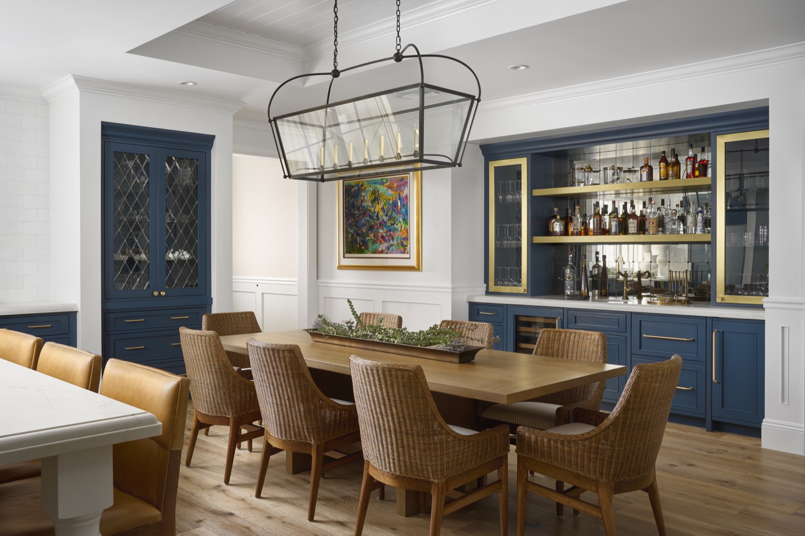 Dining room with navy glass-front display cabinetry