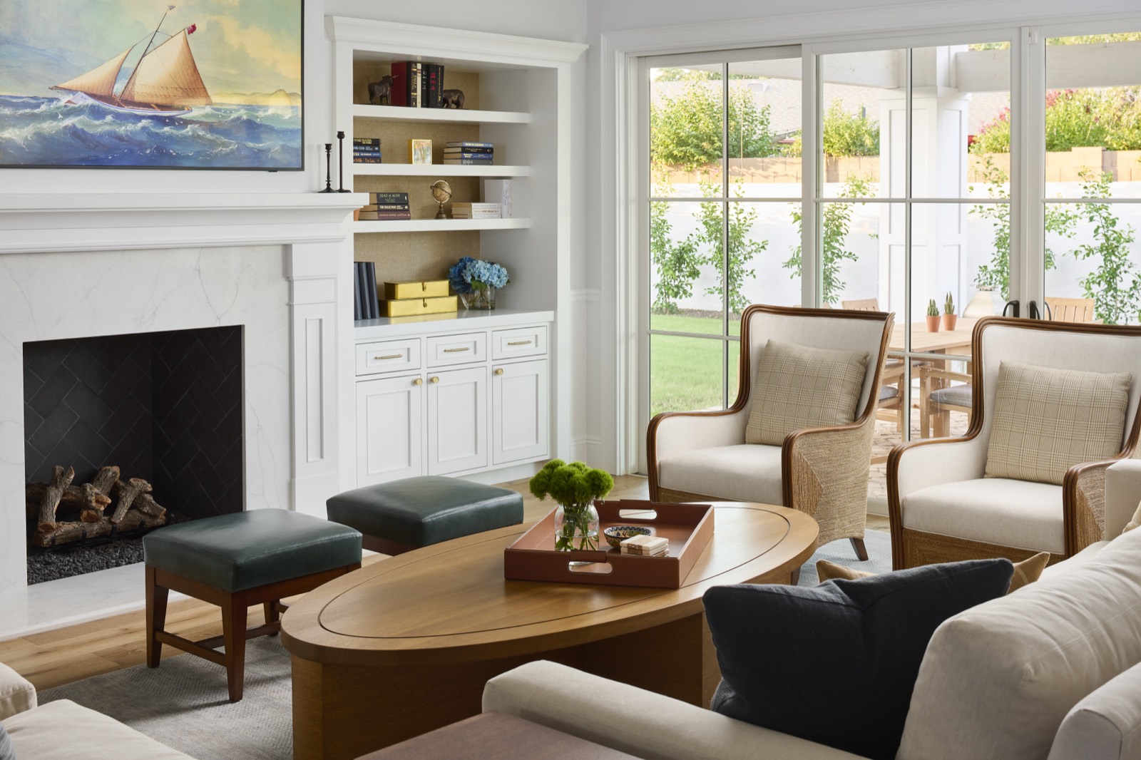 Living room with white built-in shelving around a fireplace