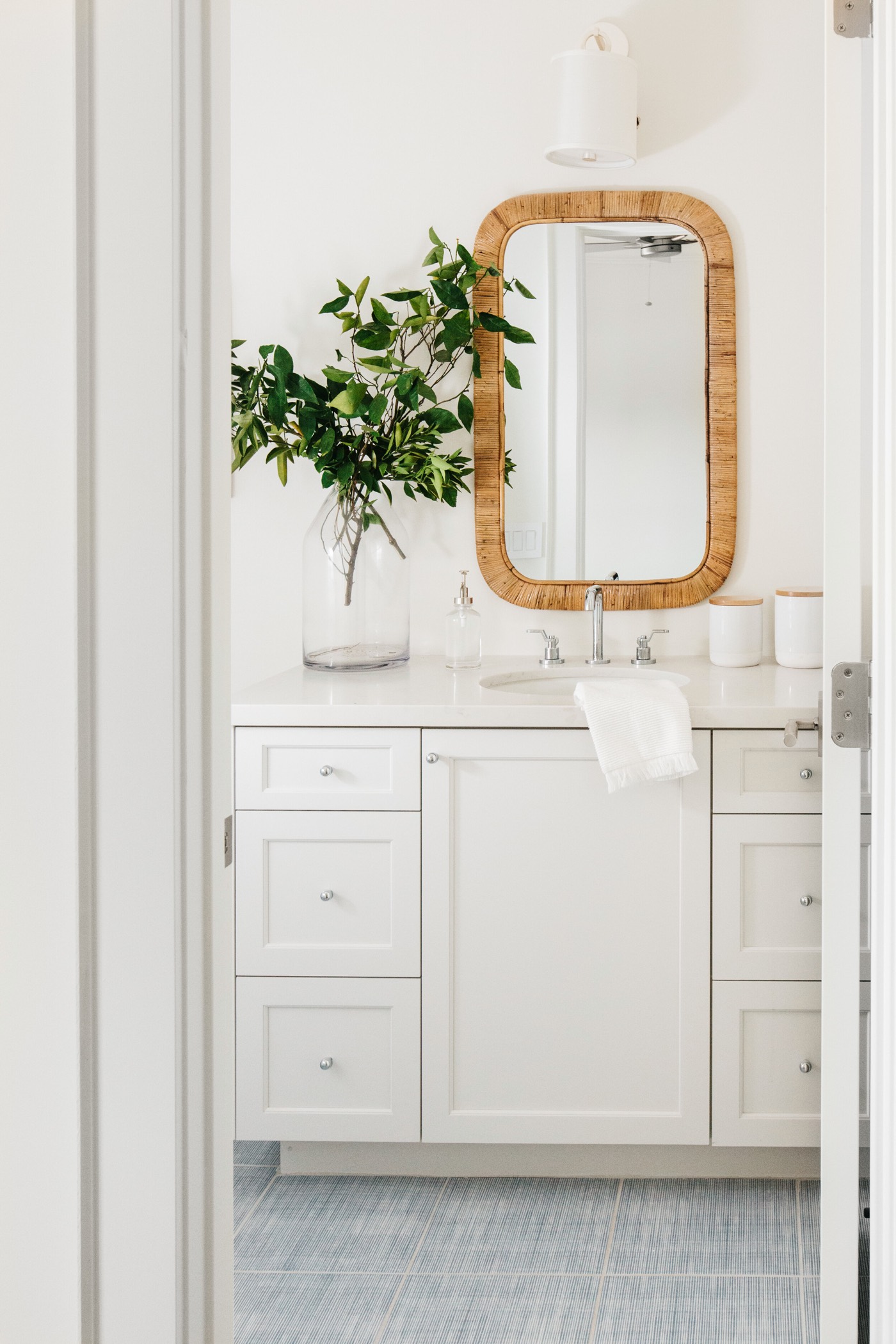 Painted vanity with a brass-framed mirror