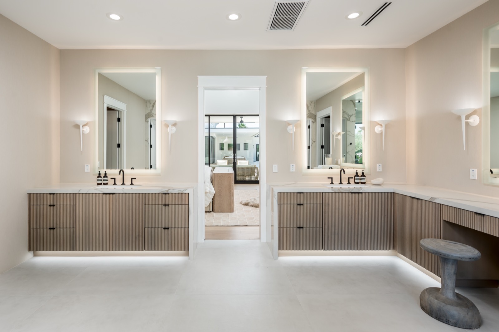 Oak double vanity with lit mirrors