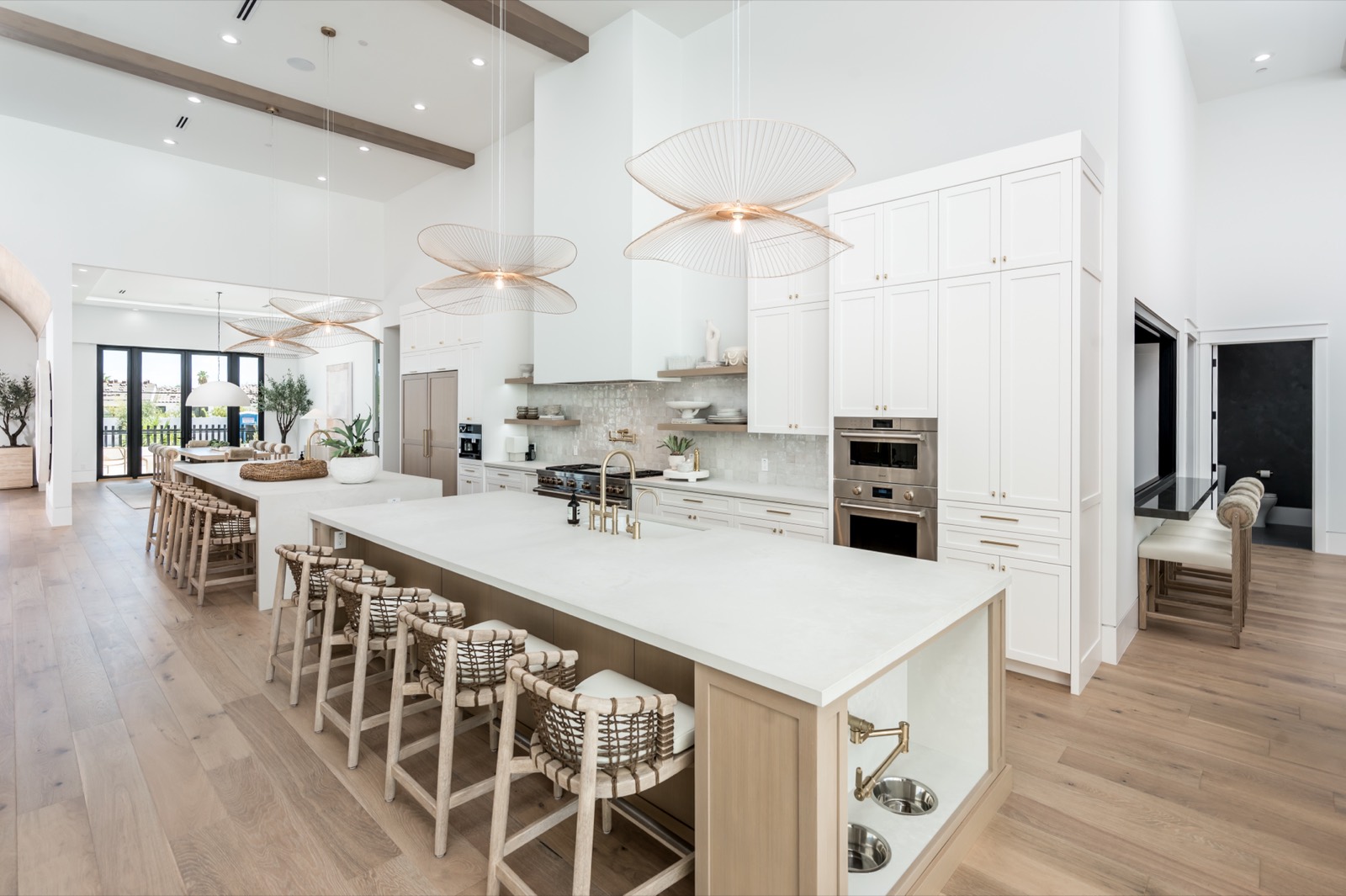 Open kitchen with oak islands beneath beams