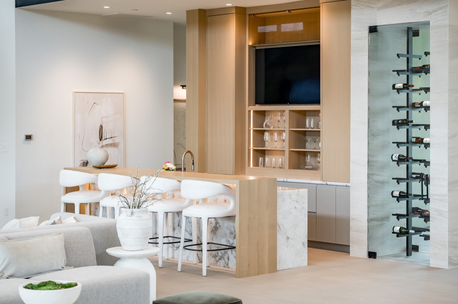 Family room bar and glass-front wine column in white oak