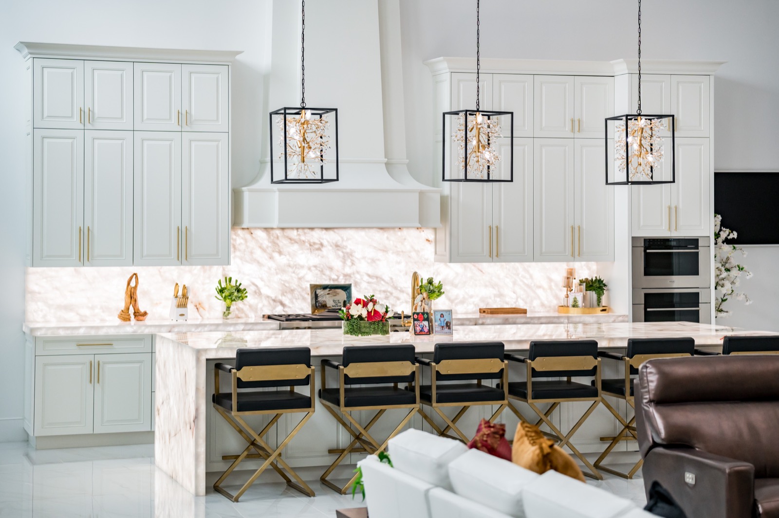 White kitchen with a veined marble island